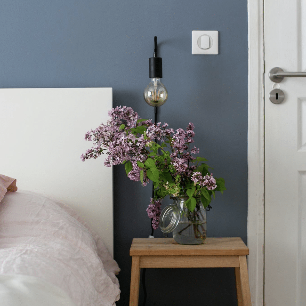 grey bedroom with purple flowers