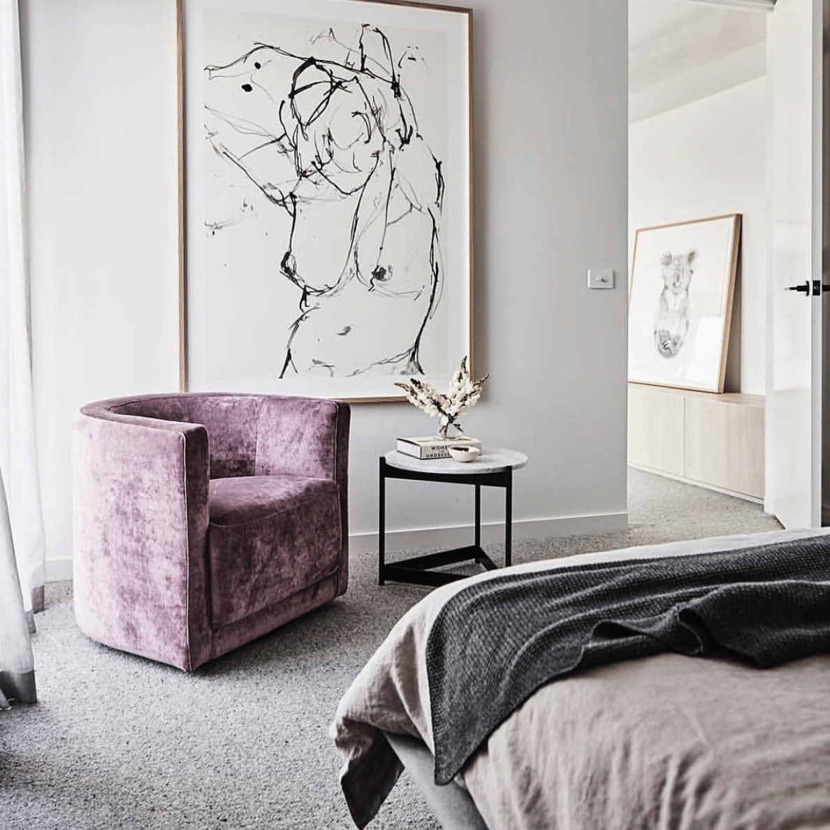 grey bedroom with purple chair