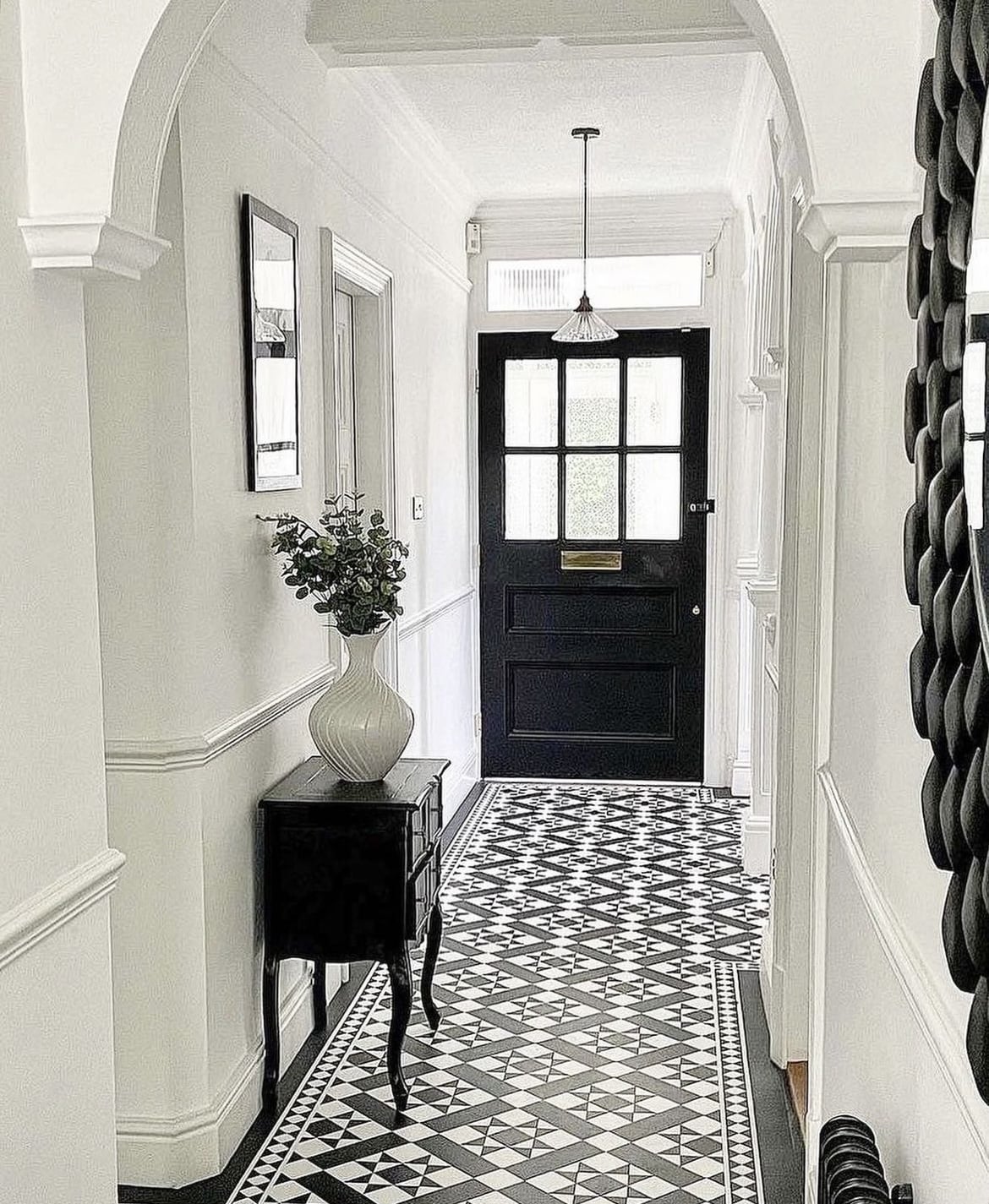 black and white tiled hallway