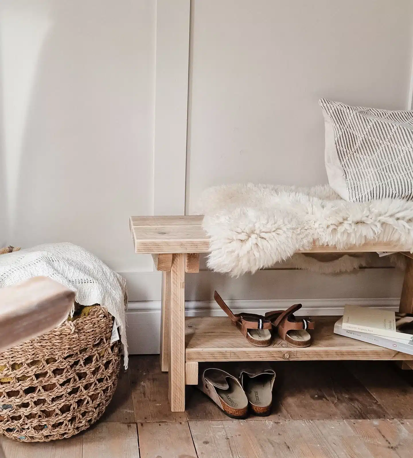 panelled hallway with wooden rustic bench with fur throw on the top and sandals underneath